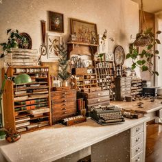 an old fashioned desk with lots of books and other items on it, including a typewriter