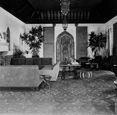 an old black and white photo of a living room