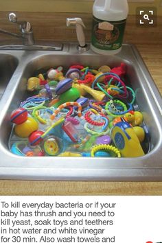 a kitchen sink filled with lots of toys