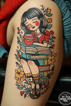 a woman with a book tattoo on her thigh