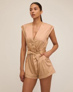 Summer V-neck Jumpsuit For Daywear, Elegant V-neck Jumpsuits And Rompers For Daywear, Summer Beige V-neck Jumpsuits And Rompers, Beige V-neck Jumpsuit For Day Out, Cotton Jumpsuits And Rompers For Night Out In Spring, Cotton Jumpsuits And Rompers For Night Out, Chic Beige Cotton Jumpsuits And Rompers, Chic Beige Cotton Jumpsuit, Summer V-neck Jumpsuits And Rompers For Night Out