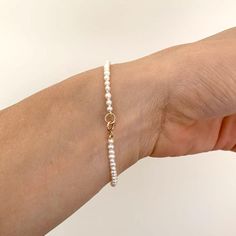 Item Details: Bracelet can be ordered in 6.5" or 7" long. Strand of 2mm freshwater seed pearls. 14K gold spring clasp. Please allow 1 week for production and delivery. Dainty Akoya Pearl Bracelet, Akoya Pearl Bracelet With Round Beads And Pearl Charm, Akoya Pearl Charm Bracelet With Round Beads, Classic Everyday Pearl Bracelet With Pearl Charm, Everyday Single Strand Akoya Pearl Jewelry, Classic Single Strand Pearl Bracelet For Everyday, Classic Everyday Single Strand Pearl Bracelet, Dainty Pearl Bracelet With Round Beads For Formal Occasions, Classic Everyday Pearl Bracelet With 14k Gold Filled