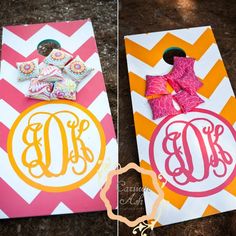 this is an image of two door hangers with monogrammed bows on them