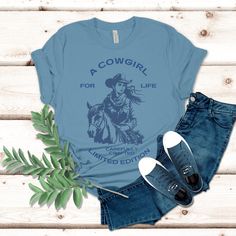 Our A Cowgirl for life t-shirt, is the perfect blend of style and western charm! Whether you're out on the ranch, riding your favorite horse, or simply rocking a casual yet chic look, this t-shirt is a must-have addition to your wardrobe. Do your t-shirts fail to keep up with your active, on-the-go lifestyle? Are you constantly tugging at your shirt or dealing with it shrinking in the wash can be a real drag, especially when you're out exploring or busy with errands. Our Bella & Canvas Unisex t- Ranch Riding, Chic Look, The Ranch, Steel Blue, Shape Design, Keep Up, Fashion Sense, For Life, Bella Canvas