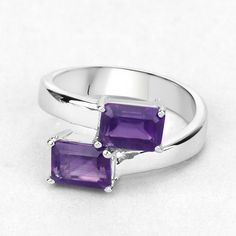 "Amethyst Ring, Amethyst Silver Bypass Ring, Natural Amethyst Ring for Women, February Birthstone Ring Flaunt yourself with this amethyst bypass ring. The natural gemstones have a combined weight of 2.00 carats and are set in .925 sterling silver with rhodium plating. The purple hue of this ring adds a pop of color to any look! The understated design and vibrant stones make this ring perfect for every occasion. amethyst bypass ring, amethyst ring, amethyst silver ring, natural amethyst silver ri Amethyst Open Ring With Accent Stones, Purple Amethyst Rings With Emerald Cut, Amethyst Open Ring With Gemstone Accents For Anniversary, Purple Amethyst Gemstone Ring For Promise, Purple Open Ring Birthstone Ring, Purple Open Birthstone Ring, Purple Gemstone Open Ring Jewelry, Purple Gemstone Birthstone Ring With Open Band, Purple Amethyst Open Ring For Anniversary