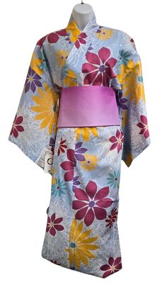 Women's Yukata in Light blue with floral print. Yukata is an unlined cotton summer kimono, worn in casual settings such as summer festivals. It is made with lightweight cotton or linen, perfect for warm weather. Yukata is traditionally worn with wood geta sandals. You can find Geta sandals here. *We sell our yukata with or without an Obi belt. Please select your preferred option. Size info: size M Yukata length and size might vary. Please see the Size chart for the estimated size. *Yukata is long, but the length is adjustable by folding excess materials at the waist (called Ohashori). You will need two koshi himo (a thin belt that keeps a kimono tightly tied together). Included only if a Yukata is purchased with an Obi belt. Material: Yukata 100% cotton, Obi belt 100% polyester, koshi himo Floral Print Kimono For Tea Ceremony, Traditional Blue Floral Kimono, Traditional Blue Floral Print Kimono, Blue Cotton Kimono For Festival, Traditional Summer Kimono With Floral Print, Traditional Floral Print Kimono For Summer, Traditional Floral Print Summer Kimono, Blue Kimono For Spring Tea Ceremony, Spring Cotton Kimono For Tea Ceremony