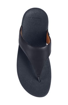 The classic flip-flop sandal gets an ergonomic update with a cushioned footbed, arch support and lifted sole. Soft terry fabric in the straps adds comfort and wicks moisture from the skin. 1 3/4" heel; 3/4" platform (size 9) Contoured cushioned footbed with arch support Leather upper/textile and synthetic lining/rubber sole Imported Classic Flip Flops With Textured Footbed And Toe Post, Classic Leather Footbed Toe Post Flip Flops, Classic Toe Post Flip Flops With Leather Footbed, Classic Toe Post Flip Flops With Textured Footbed, Adjustable Leather Slippers With Arch Support, Classic Leather Flip Flops, Synthetic Slides With Cushioned Footbed And Toe Post, Classic Toe Post Sandals With Cushioned Footbed, Synthetic Toe Post Sandals With Ortholite Insole