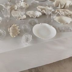 a table topped with lots of glass dishes