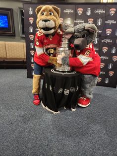 the mascot poses with the stanleys cup