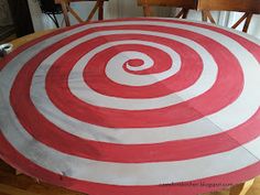 a red and white rug sitting on top of a wooden table