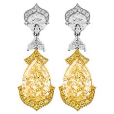 Drop earrings in Platinum & 18K Yellow Gold Stones: 5.27ct Pear Shape Fancy Light Yellow VS2 GIA#7318048698 5.27ct Pear Shape Fancy Light Yellow SI1 GIA#5172457568 PERFECT MATCHING PAIR!!! Round stones 0.70ct each (Total Carat Weight:1.40ct) Total Carat Weight pave Yellow: 0.27ct Total Carat Weight pave White: 0.29ct Total Carat Weight of all small stones: 0.60ct Comes in a box, with 2 GIA Certificates, appraisal available upon request Retail Value: 300,000$ Apple Earrings, Fancy Light, Treasure Jewelry, Yellow Diamonds, Fancy Lights, Girly Accessories, Expensive Jewelry, Jewelry Brand, Women Diamond