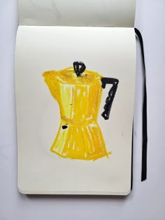 a drawing of a yellow dress on a piece of paper with a black cord attached to it