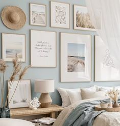 a bedroom with blue walls and pictures on the wall above the bed, along with wicker baskets