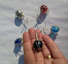 Something for the keen entomologist or collector of unusual brooches- a weevil brooch for your jacket or hat! I hand make each one to order, myself, in Scotland so you can choose the colour that best suits your outfit and attitude! They are around 4cm, 1.5in long and made from silver plated copper wire and a fiat glass pebble with a brooch back soldered on the back. Despite the fact that you wouldn't feel very pleased to find one of these guys in your sack of flour or store of garden seeds their Unique Handmade Collectible Pins, Insect Wall, Outside The Box, Thinking Outside The Box, Cool Suits, Garden Seeds, Friend Birthday, Copper Wire, The Box