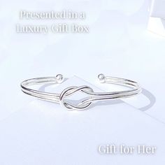 Our silver knot style silver bangle bracelet for women is a unique design of bangle and the perfect accessory. Stack it with other bracelets or wear it on it's own.  This silver bracelet comes delivered in a luxury branded gift box.     Bracelet Features - Silver Knot Open Bangle - Delivered in a stylish branded gift box - Free UK Delivery - Discounted Tracked Worldwide delivery  - Gift wrapping available at checkout Materials  - Brass base metal / Triple Silver Plated Returns & Exchanges - Plea Women Jewellery, Silver Bangle Bracelet, Open Bangle, Gift For Her Birthday, Delivery Gifts, Branded Gifts, Silver Bangle Bracelets, Jewellery Gift, Silver Bangle