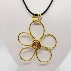 Striking simple gold flower pendant, hand made in the UK This bold eye-catching flower is made from coated aluminium and will be hand made to order so no two will be exactly identical! The pendant will be sent on a black waxed cotton cord but you could of course add it to your own chain later if you prefer. I will send this wrapped in tissue and in an organza bag so it would make a lovely gift for a special friend, or just treat yourself! Cord length is 45cm plus 5cm extension chain  Pendant is Unique Gold Jewelry With Flower Charm, Gold Metal Flower Necklace As Gift, Handmade Gold Flower Necklace, Handmade Gold Necklace With Flower Pendant, Gold Pendant Flower Necklace, Adjustable Gold Necklace With Flower Pendant, Abstract Flower Pendant, Adjustable Yellow Flower Pendant Necklace, Yellow Flower-shaped Necklaces For Gifts