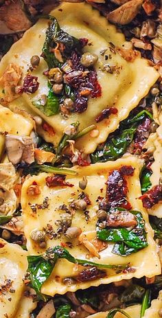 pasta with spinach, mushrooms and other toppings in a dish on a table