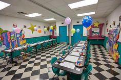 an empty classroom with tables and balloons