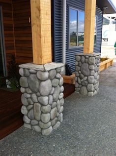 two stone pillars sitting next to each other