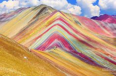 colorful mountains with clouds in the sky