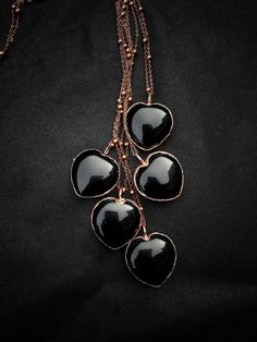 Black Obsidian gemstones pendants available You can choose your size pendant and length chain (the measure is available in the photo gallery). Pendante size  30x30 mm This necklace is made with a black obsidian electroformed into a setting of dripping copper and exudes raw elegance. Each heart and the way I apply the copper are slightly different. Copper plated through a galvanization process. The result is spectacular because copper amplifies the energy of the stone with which it is combined. C Black Metal Jewelry For Valentine's Day, Valentine's Day Black Metal Jewelry, Black Heart Charm Pendant Jewelry, Black Metal Necklace With Heart Charm, Black Pendant Jewelry With Heart Charm, Black Metal Heart Necklace For Valentine's Day, Black Metal Heart Charm Necklace, Black Metal Heart Necklace With Charm, Black Metal Heart Necklace With Heart Charm