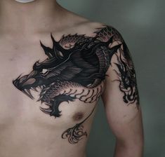 a man with a dragon tattoo on his chest