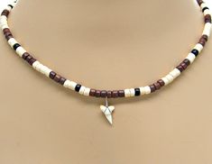 White Shark Tooth Necklace 18" Coconut Bead SUP Surfer Hawaiian Beach Sharks Teeth Jewelry 7032-WL #surfer #sup #beach #SharkTooth #necklace #pendant #coconut #BeachJewelry #SharkToothNecklace #NecklacePendant Dainty Shark Tooth Necklace Smile The Ocean, Sand Tiger Shark Tooth Necklace, Shark Teeth Jewelry, Sharks Teeth, Small Shark, Shell Beads Necklace, Shark Tooth Necklace, Teeth Jewelry, Tooth Necklace