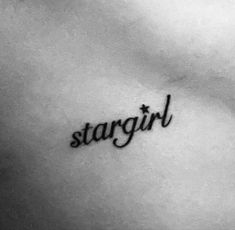 a woman's stomach with the word stargirl written in cursive font