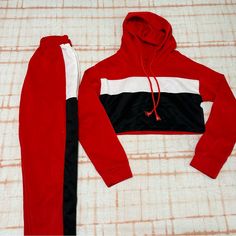 Red, Black And White Tracksuit For Women. In The Purchase Is Two Pieces Included Really Cute Two Piece Cropped Hoodie Shirt They Can Be A Cute Workout Piece Or A Lounge Wear There's Not A Brand Or Size But It'll Fit A Size Medium To Small. Very Breathable Fabric Never Worn Once Before It Gives Me Lana Del Ray Racer Vibes With The Red And Stripes #Lana #Racer #Tracksuit #Matchingset White Tracksuit, Racer Jacket, Lana Del Ray, Cropped Hoodie, Two Pieces, Lady In Red, Breathable Fabric, Pants Set, Pant Jumpsuit