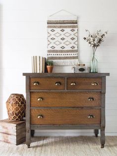 an old dresser has been painted with white paint