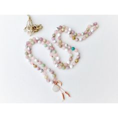 This dreamy mala necklace is filled with airy pastel colors and beautiful light energy. This 108 mala necklace is composed of Amazonite, Rose Quartz, Kunzite, Howlite and a Rainbow Moonstone Guru Crystal. Strung on a pink silk cord with Rose Gold Accents giving it a touch of tenderness and ooze with feminine energy. All Malas are saged to cleanse the energy before they are shipped to their new home. G E M S T O N E P R O P E R T I E S ♥ KUNZITE is a powerful healer of the emotional body, particu Bohemian Pink Crystal Necklace With Gemstone Beads, Pink Bohemian Crystal Necklace With Gemstone Beads, Spiritual Pink Beaded Necklaces With Natural Stones, Hand Wrapped Pink Spiritual Necklaces, Pink Spiritual Hand Wrapped Necklaces, Pink Spiritual Hand Wrapped Necklace, Spiritual Pink Hand Wrapped Necklaces, Spiritual Pink Hand Wrapped Necklace, White Rose Quartz Round Bead Necklaces