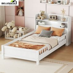 a white bed sitting on top of a wooden floor next to a book shelf filled with books