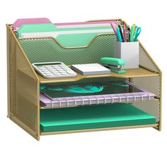 a desk with a pen holder, calculator and pencils