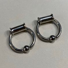 ♥♥♥ TUNNELS with Hoops ♥♥♥Double flare surgical steel TunnelRemoveable Hoops - surgical steel12G 5/8” or 3/4" (3 Grams)Choose from sizes....♥ 4G or 5mm♥ 2G or 6mm♥ 0G or 8mm♥ 00G or 10mm♥ 1/2" or 12mm ♥ 9/16" or 14mm ♥ 5/8" or 16mm♥ 3/4" or 19mm♥ 7/8" or 22mm♥ 1" or 25mmFor use in healed stretches.Thank you for visiting Jeweled Navel!********************RETURNS********************I do apologize for the inconvenience, but body jewelry CANNOT BE RETURNED for sanitary reasons. Thank you for your un Small Gauged Ears Women, Bead Rings, Face Piercings, Multiple Ear Piercings, Plug Earrings, Ear Tunnels, Cute Piercings, Jewelry Tattoo, Body Jewelry Piercing