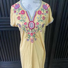 Beautiful Cotton Dress In A Light Yellow With Bright Embroidery. Comfy And Great To Throw On And Go. 34 Long And About 19 Bust Laid Flat. Nwt. Embroidered Yellow Beach Dress, Yellow Embroidered V-neck Dress, Yellow Cotton Dress With Floral Embroidery, Yellow Bohemian Dress With Floral Embroidery, Yellow Embroidered Summer Dress, Yellow Summer Embroidered Dress, Spring Yellow Embroidered Dress With Short Sleeves, Yellow Embroidered Hem Dress For Summer, Yellow Summer Dresses With Embroidered Hem