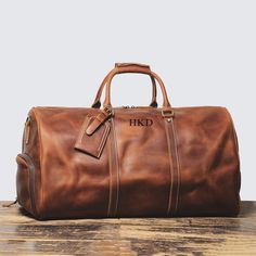 Groomsman Gift Duffle Bag, Personalized Leather Travel Bag, Overnight Bag, Weekend Bag, Duffel Bag, Father's Gift, Gift for Him Personalization: We can engrave initials on the front. Please leave a note at checkout with what you would like personalized on. Features: 1. This overnight bag is mainly made of full grain cowhide leather.  Suitable for weekend trips, short-term business trips, and daily trips, and with enough space for travel necessities. 2. The weekender bag with shoe compartment can Bachelor Gifts, Travel Necessities, Groomsman Gift, Genuine Leather Totes, Leather Travel Bag, Weekend Bag, Travel Duffel, Duffel Bags, Duffel Bag Travel