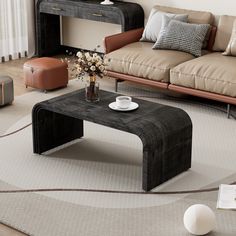 a living room filled with furniture and a coffee table