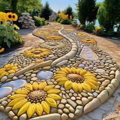 a stone pathway with sunflowers painted on it