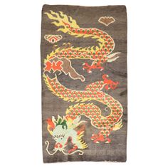 A 3rd quarter of the 20th-century Tibetan rug with a dragon motif on a brown field Size: 3'1'' x 58''. Tibetan Dragon, Tibetan Rug, Vintage Asian Art, Dragon Tattoo Art, Dragon Motif, Tibetan Rugs, Asian Rugs, Vintage Dragon, East Asian