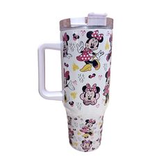 a white cup with minnie mouses on it