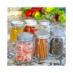 several jars filled with different types of spices