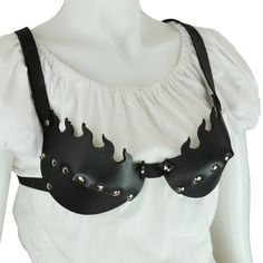 Our Flamed Leather Bra is crafted from medium weight leather with a shaped cup that provides an excellent fit. Our leather bras come in cup sizes A through D and feature a adjustable strap and buckle harness system. The straps are made from soft, supple black leather, so there is no discomfort from rubbing against your skin. The cups on this leather bra are made of two pieces that are riveted together. The cups feature an appearance of uprising flames. This leather bra would look lovely with any Leather Bras, Goth Kitty, Fashion 23, Medieval Collectibles, Leather Inspiration, Under Bust Corset, Leather Clothes, Clothing Crafts, Leather Bra