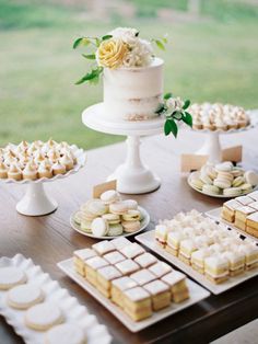 a table topped with lots of desserts and cakes