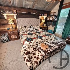 a bed room with a neatly made bed next to a window and a sign that says new