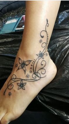 a woman with a tattoo on her foot