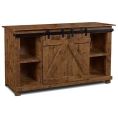 a wooden entertainment center with sliding doors