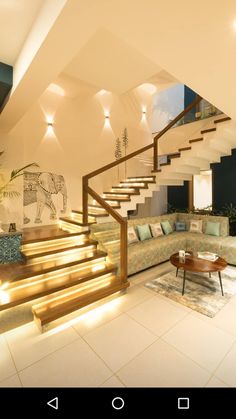 a living room filled with furniture and stairs