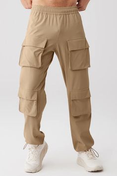 Cargo Venture Pant - Gravel | Alo Yoga Alo Yoga Solid Color Pants With Pockets, Alo Yoga Solid Pants With Pockets, Alo Yoga Relaxed Fit Pants With Pockets, Alo Yoga Pants With Pockets, Alo Yoga Athleisure Pants With Pockets, Khaki Sports Bottoms With Cargo Pockets, Sporty Alo Yoga Pants With Pockets, Sporty Alo Yoga Bottoms With Pockets, Sports Cargo Pants With Functional Pockets