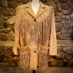 "Beautiful. Classic. A rare treasure that is not easy to part with, but it's too big for me now and someone could get lots of enjoyment out of it. Long leather fringe across front, from shoulder to shoulder and extending all across the back with the same fringe hanging from the front pockets. Classy beige and red embroidery detail with \"nail head\" type embellishments to accent. Excellent condition from the 1970's. Size 18W Feel free to message me for any measurements" Fall Leather Tassel Outerwear, Leather Tassel Outerwear For Fall, Winter Leather Tassel Outerwear, Winter Leather Outerwear With Tassels, Leather Fringe Outerwear For Fall, Fall Leather Outerwear With Fringe, Rodeo Outerwear With Tassels, Leather Fringe Outerwear For Rodeo, Leather Outerwear With Fringe For Rodeo