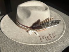 "Wedding Custom hand burned wide brimmed Boho Western Hat made to order just for you.  Colors: Cream Sand (Light Tan) Cognac (Dark Tan) When my dad passed away, I made my mom a hat to commemorate him... with places they've traveled, songs they sung, and things that reminded her of him. I loved it so much, I made myself one with my moms favorite Bible verse, my dads ammo casing and so many things I cherish. When I posted them to my friends, I started getting others wanting a special custom hat.  One for a gift to attend a concert. We put the nickname name her Papaw gave her on the hat and a replica of her tickets with the date she was attending the concert.  Another one with a paw print to commemorate her dog Beau, and the lyrics to \"You are my Sunshine\" For another, I replicated her tatt Burned Wedding Hat, Cream Brimmed Hat For Western-themed Events, Wide Brim Distressed Brown Hat For Western-themed Events, Artisan Flat Brim Hat For Western-themed Events, Burned Wide Brim Hats, Cowboy Hat Design, Hat Burning, Hand Burn, Western Hat